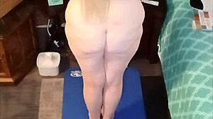 Vee starts her day with naked yoga, showcasing her big tits and ass in the early morning light.