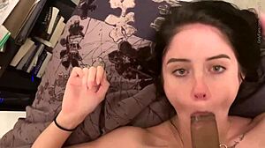 In this amateur scene, a skinny teen slut eagerly sucks on a big cock, her lips wrapped tightly around it.