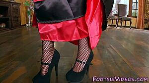 Beautiful woman gives a sensual foot massage with oil