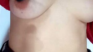 Playing rough with a belt spanking my bare tits