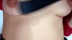 Playing rough with a belt spanking my bare tits