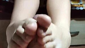 Asian Girl Satisfies Big Cock With Legs And Hands