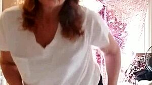 milf applies lotion to her sexy skin