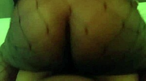 Ebony cowgirl rides in black setting with intriguing contrast