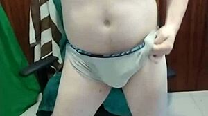 gay guy masturbates cock against intriguing chair in solo session