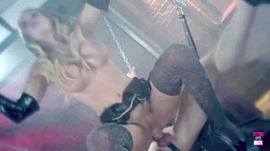 blonde sucks dick of tied up guy with bdsm mask on