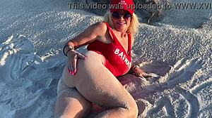 Public pussy play on the beach with onlookers nearby