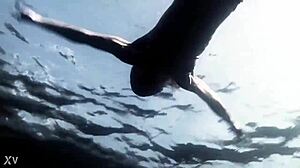 Beautiful blonde swims in the lake and shows her charms
