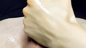 Oiled Handjob Leads To Massive Cum Bust