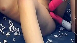 Girl pleasures pussy with two dildos