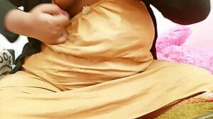 Hyderabadi aunty says, Look at my big tits, you can’t resist touching them, can you? She teases with every word.