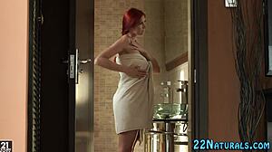 Redhead babe with small tits masturbates in shower