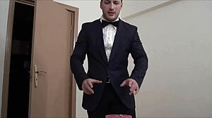 The waiter hulk is masturbating, his muscular bodybuilder form on display for all to see.