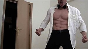 The waiter hulk is masturbating, his muscular bodybuilder form on display for all to see.