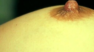 Examining the nipples of a beautiful woman with great passion