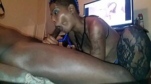 Ebony babe sucks and licks black cock.