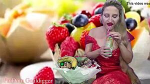 Financial dominatrix in glasses masturbates with food fetish domination