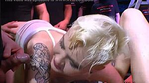 A tattooed slut enjoys a golden shower