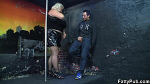 A blonde BBW with amazing big boobs gets gang banged on a night club dance floor