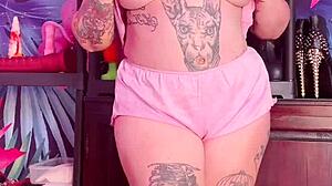 Beautiful woman with an amazing set of large natural breasts and a great ass wears silk pajamas