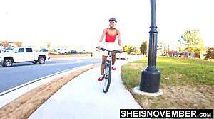 pretty ebony babe rides bike with upskirt nudity! tiny butt exposed!