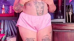 Beautiful woman with an amazing set of large natural breasts and a great ass wears silk pajamas