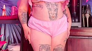 Beautiful woman with an amazing set of large natural breasts and a great ass wears silk pajamas