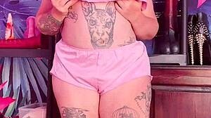 Beautiful woman with an amazing set of large natural breasts and a great ass wears silk pajamas