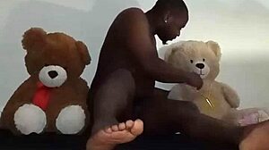 Enjoying a threesome with brown and caucasian furry toy bears during foreplay and massage