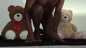 Enjoying a threesome with brown and caucasian furry toy bears during foreplay and massage