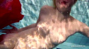 Young Russian girl Lucie swims in the pool