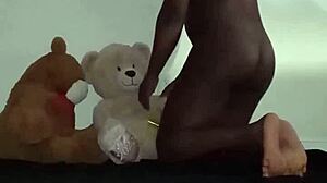 Enjoying a threesome with brown and caucasian furry toy bears during foreplay and massage