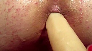 I, Elly, gets my ass fuckt with a dildo from behing, oh god it's so good!