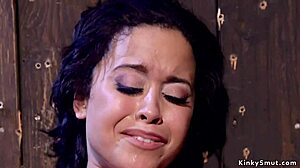 Beautiful brunette gets flogged and teased in bondage