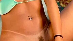 Beautiful young brunette experiences intense orgasms