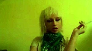 Pretty girl playing video games while smoking cigarettes