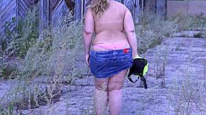 curvy milf strips outdoors showing big ass