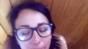 Beautiful woman with glasses has facial after a hot blowjob and doggy style sex