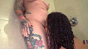 Girl on girl kissing in shower with curvy babes