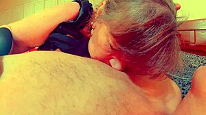Younger woman gives blow job to older goth woman