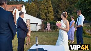 A lovely love scene with a bride in a dress in an outdoor setting