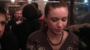 Two women engage in oral sex with a man in public