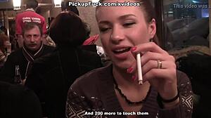 Two women engage in oral sex with a man in public