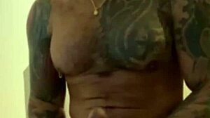 Tattooed Latino Viktor Rom masturbates his huge cock in homemade session