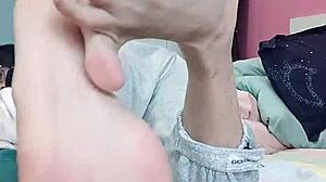 Slim gay teen devours sexy feet in wild foot fetish session