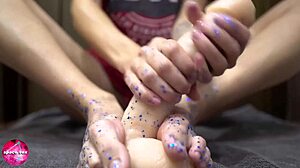 Beautiful woman gives a sensual footjob to a man with a rubber cock – foot fetish content
