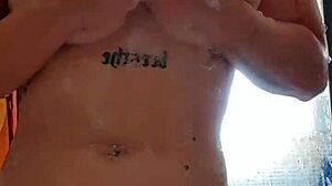 In the shower, she masturbates her big tits to an unlimited orgasm.