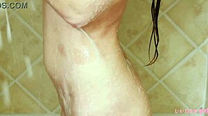adorable brunette model cleans up in steamy shower