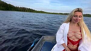 Amateur couple has fun on the boat on the lake
