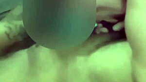 She's giving a deep interracial blowjob to him.